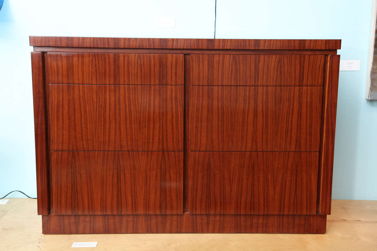 Produced by the very high end cabinet makers Schmieg & Kotzian for a private commission.  Matched rosewood veneer, 6 drawers, with Schoen's signature non-hardware drawer pulls.  Lower 4 drawers are sized to fit files and can be used as such or for