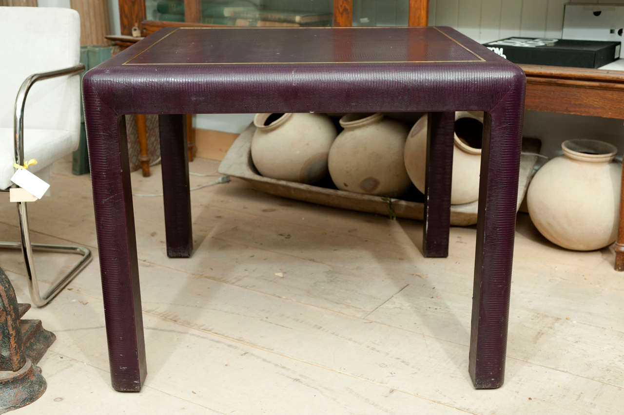 1980's Karl Springer Games Table in purple stamped leather. This is stamped and signed and has gorgeous, simple brass framing around the top.