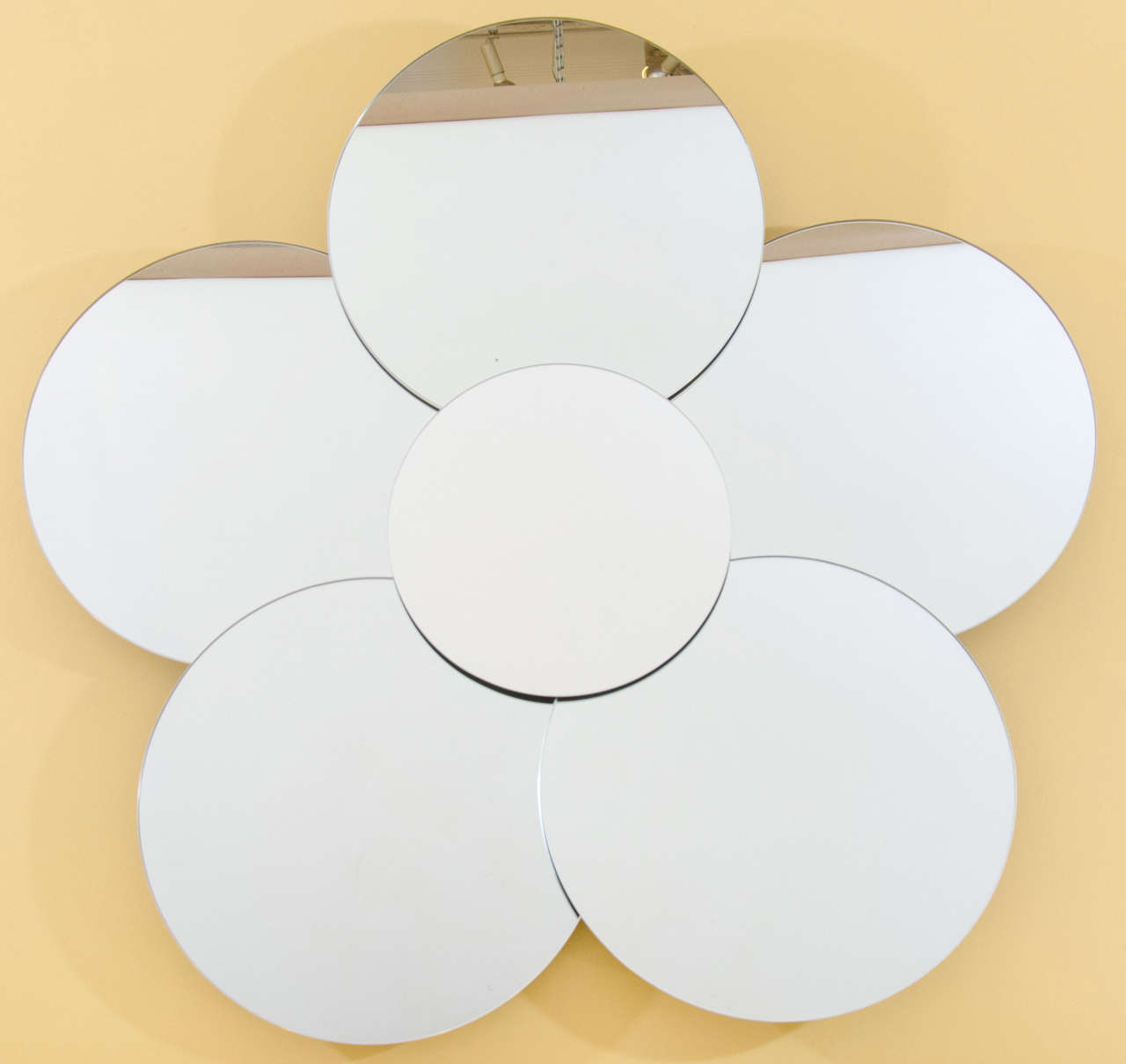 Big, bold and charming pop art flower mirror. Six mirrored discs are layered and arranged for the effect. Fantastic! Please contact for location.