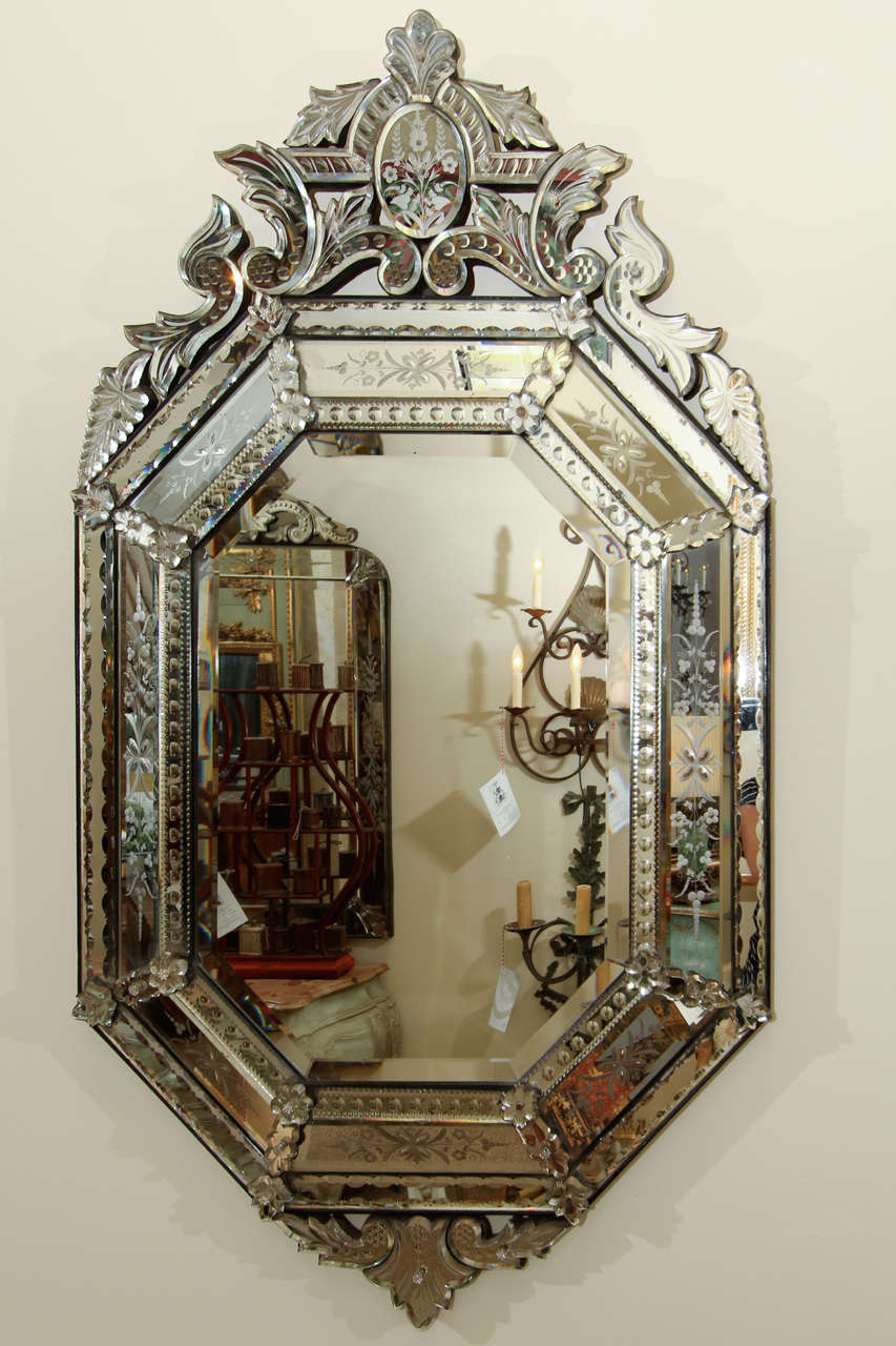 An eight sided late 19th century Venetian mirror with cut and etched glass.