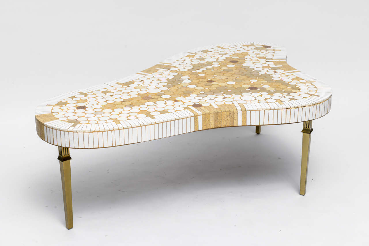 Fabulous late-50's  amorphic coffee table by Richard Hohenberg for Hohenberg Originals. Op-Art white, gold, and metallic tile top is perched on stately brass legs - a wild clash of Hollywood Regency and 60's Mod that works! (We call it Bal Harbour