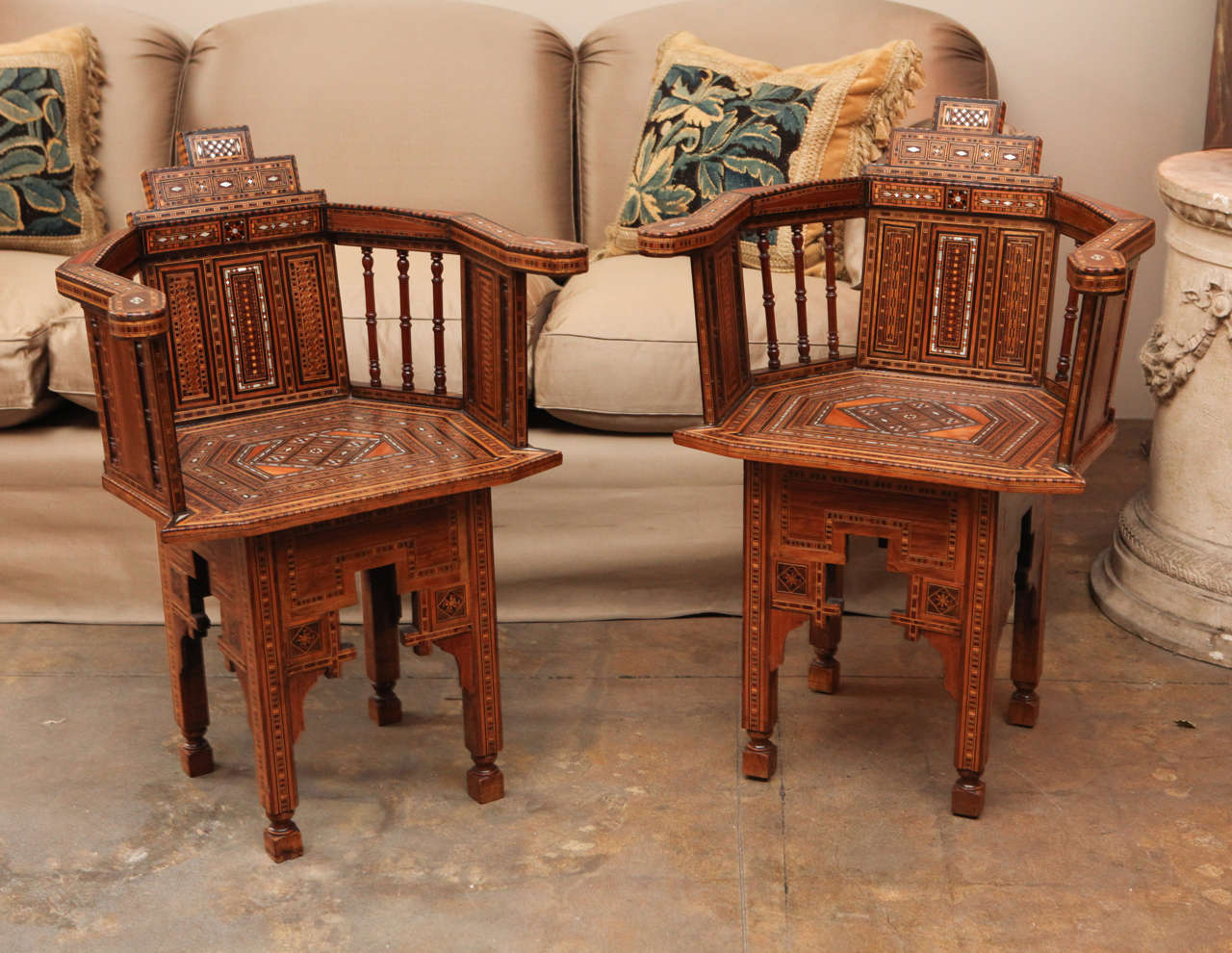 Pair of Moroccan chairs that are elaborately decorated with mother-of-pearl inlays.