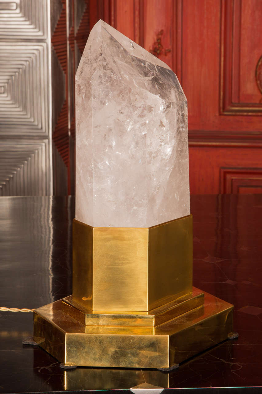Rock crystal set in lamp in brass base with inside lighting.