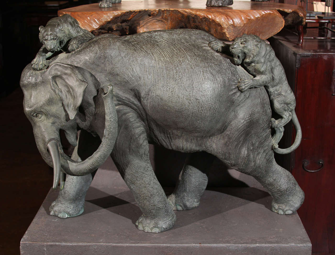 Massive Japanese Meiji-era sculpture of an elephant attacked by two tigers. 
Signed by Genryusai Seiya. 
Meiji Era.