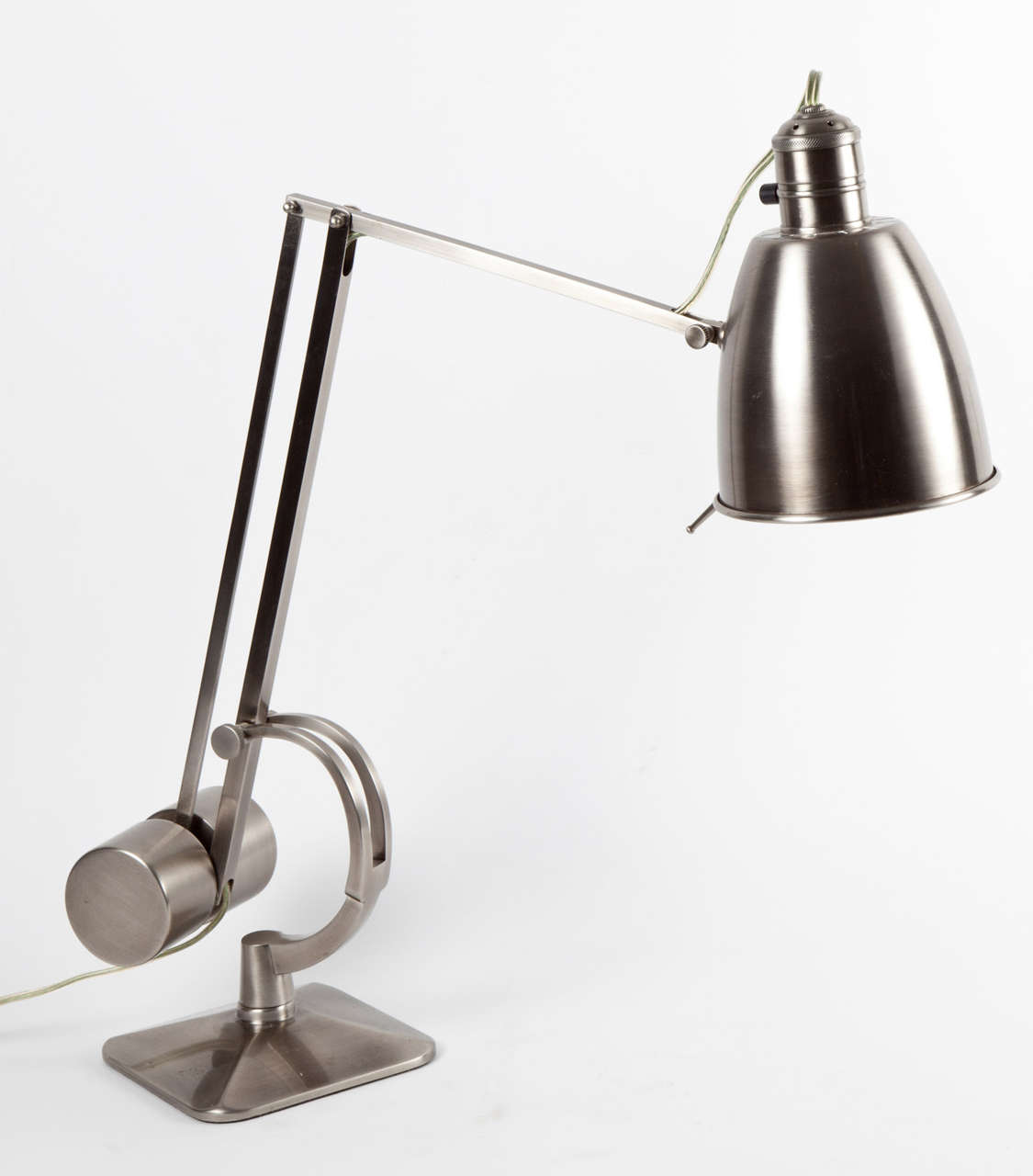 Vintage style counterweight desk lamp by Hadrill & Horstmann Limited, England, circa 1980-1990. Brushed aluminum finish. Adjustable arm. Wired for U.S. and takes a standard bulb, 75 watts max.