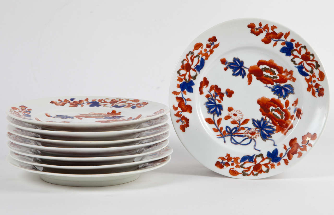 A set of eight (8) Chamberlin's Worcester boldly-colored porcelain dessert or salad plates in the Japan Imari pattern #982. England, 1820. Signed with hand applied mark. 

A rare and fine example of English porcelain, this hand painted piece