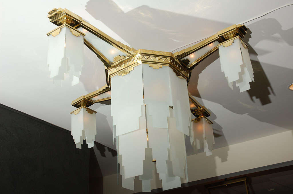 Stunning and impressive chandelier attributed to Gagneau, France, 1927. Heavy brass with frosted glass panels. Unusual design perfect for grand entry, dining rooms and living room spaces.