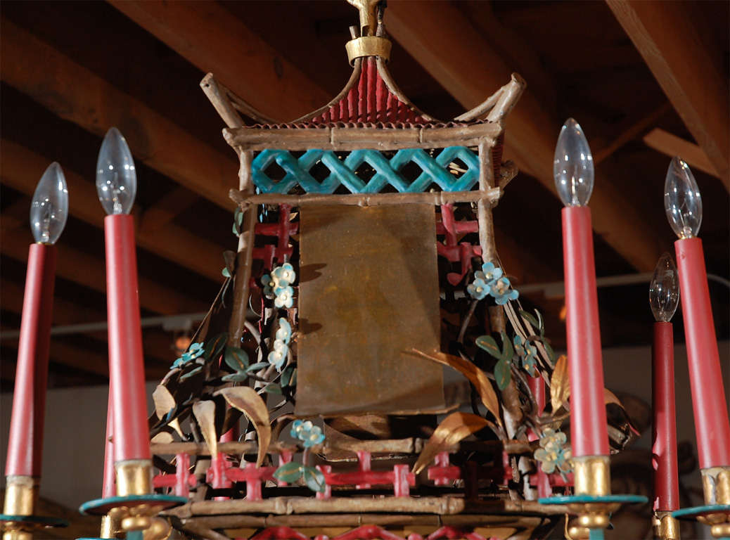 Colorful, pagoda chandelier in parcel gilt and painted iron, with eight lights.