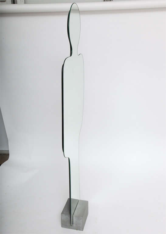 Full length Pierre Cardin Mirror that sits in a travertine base.

manufactured by Acerbis