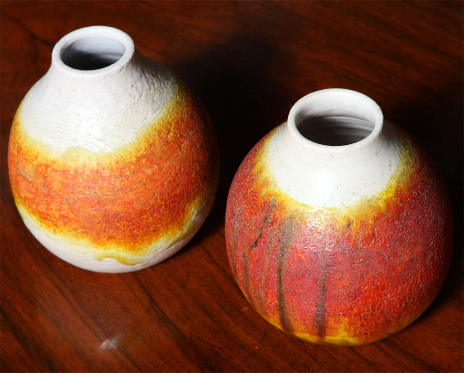 The ceramic with orange and cream glaze.