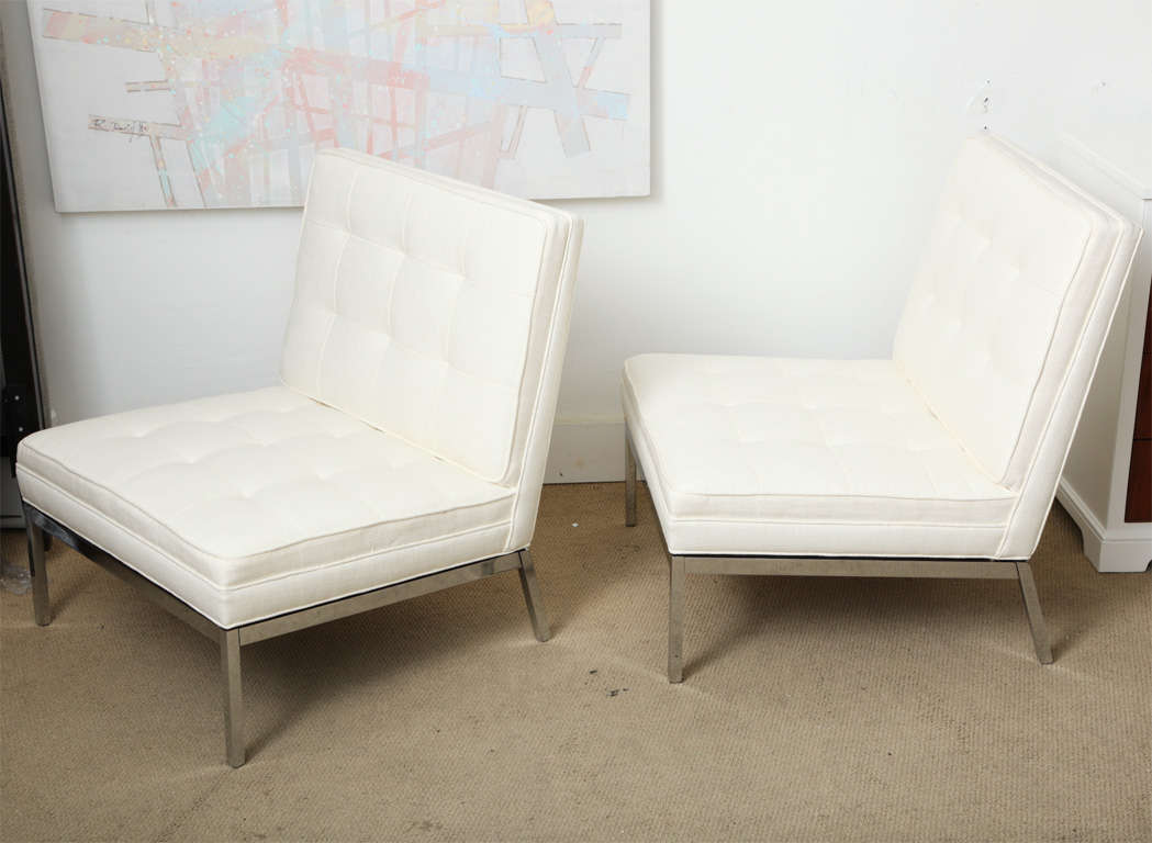 A CLASIC PAIR OF FLORENCE KNOLL ELEGANT SLIPPER CHAIRS DATING BACK TO 1950,S . THESE WERE TOTALLY RE FURBISHED BACK TO THE ORIGINAL CONDITION.THE METAL HAS BEEN RE-PLATED AND THE SEATS RE-OPHOLSTERED IN ITS ORIGINAL SHOWROOM PATTERN