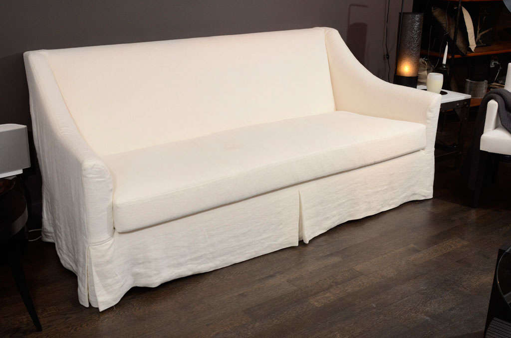 Classic hardwood frame slip covered sofa with single foam and feather down cushion easily seats up to four people serving as the perfect host for large gatherings or quality family time. Slip cover optional. Made in USA for Interieurs.