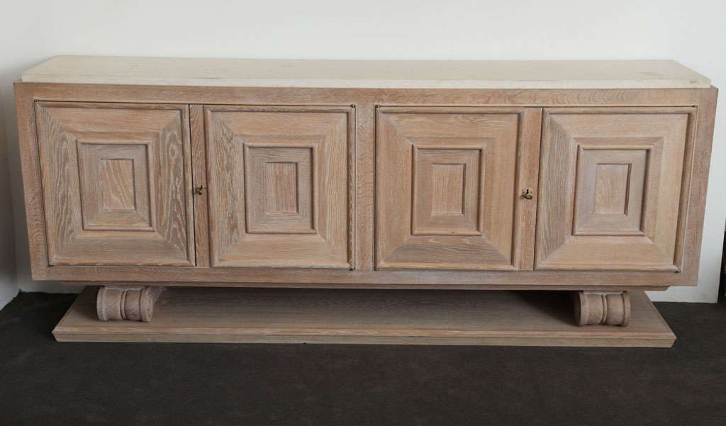 Pair of limed-oak cabinets with limestone tops