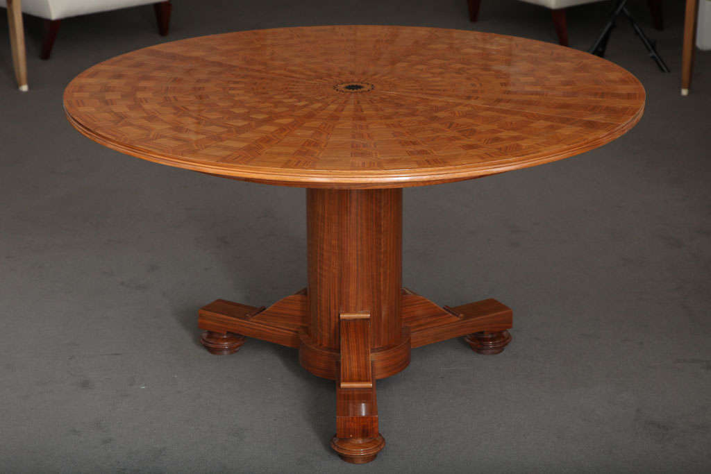 Large center table/ extension dining table by Jules Leleu in sycamore marquetry with an inlaid ebony sunburst design in the center

Signed 