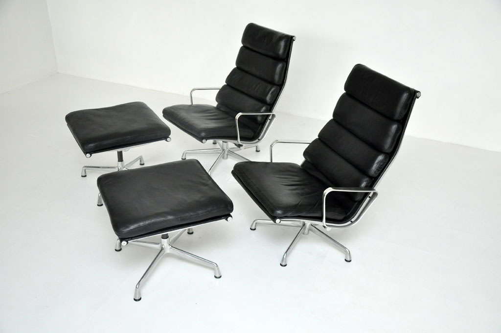 Charles Eames designed Aluminum Group lounge chair with ottoman.  Produced by Herman Miller.  Leather soft pads with aluminum frames.  

A PAIR IS AVAILABLE.  Priced per set.