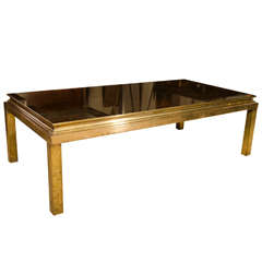 A Jansen Black Mirrored and Bronze Base Coffee Table