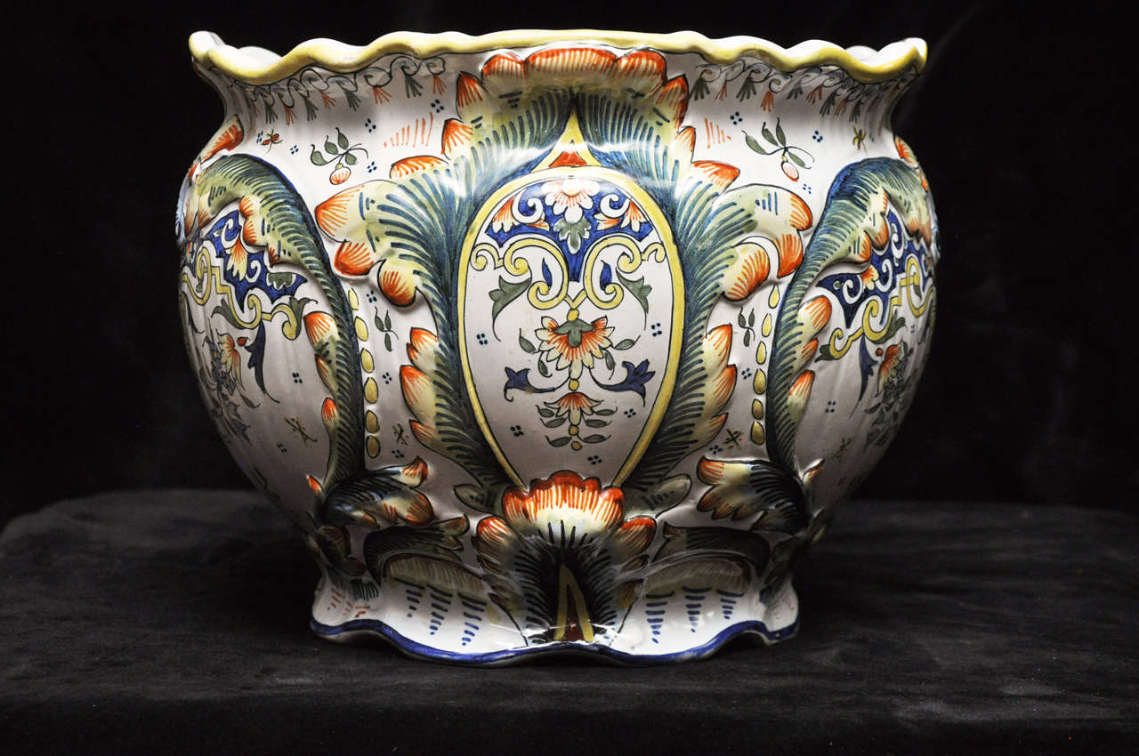A brilliant pair of fine, French polychrome faience Jardinieres beautifully hand-painted in the style made famous by the skilled artisans of Rouen, France. Fluted at rim and base.