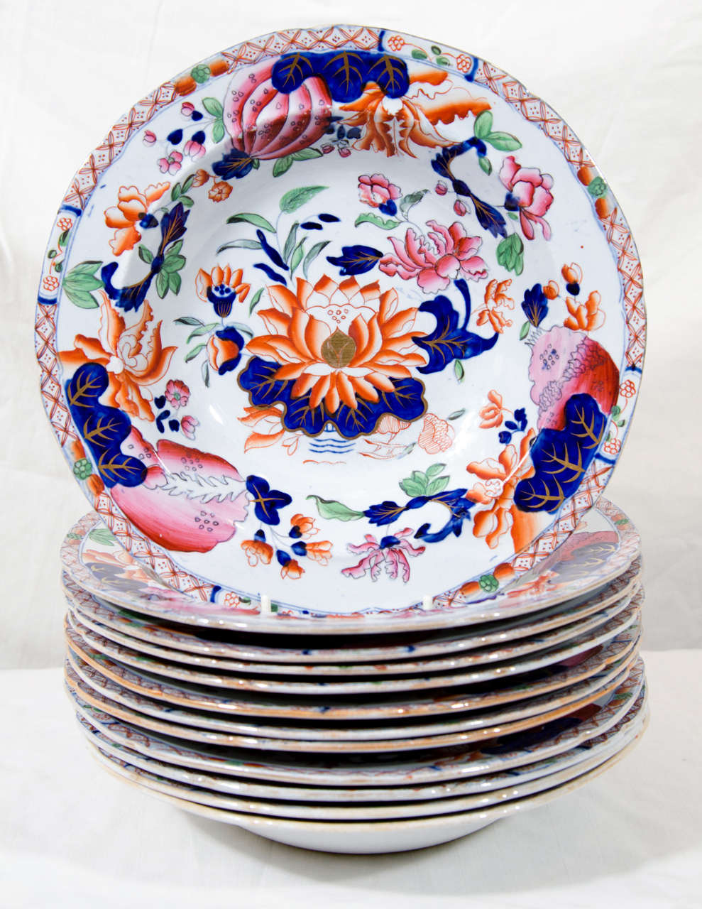In Chinese tradition the lotus symbolizes longevity, nobility, purity, and harmony. Made by Hicks and Meigh in the early 19th century this lovely English design was inspired by Japanese Imari and Chinese Famille Rose patterns of the 18th century.