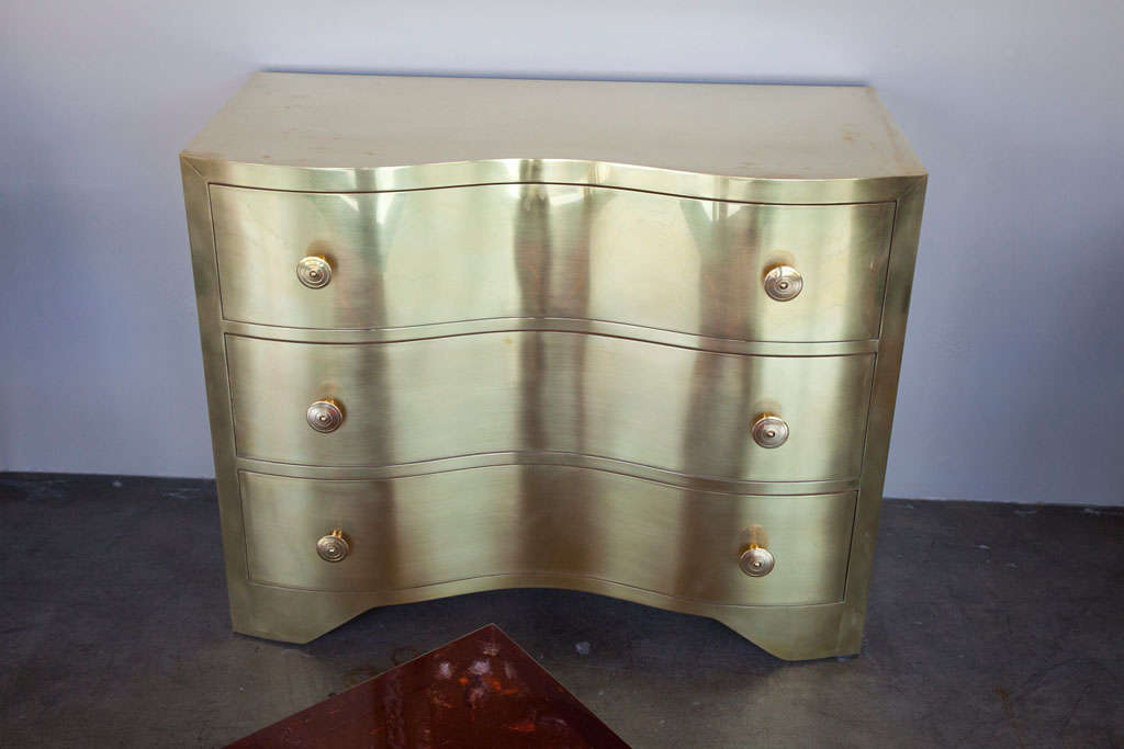 Brass three drawer chest with a Serpentine form. By order.