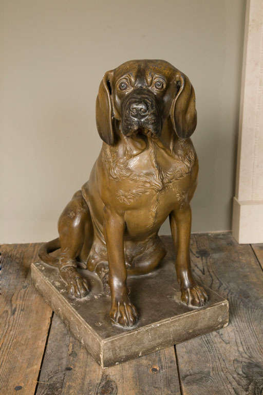 A George III Painted Lead model of a Dog Attributed to John Cheere, Circa 1760. Probably Hogarth's dog Trump, depicted seated, naturalistically painted and on a rectangular stone plinth. It is said that of the three dogs Hogarth owned, Trump was his