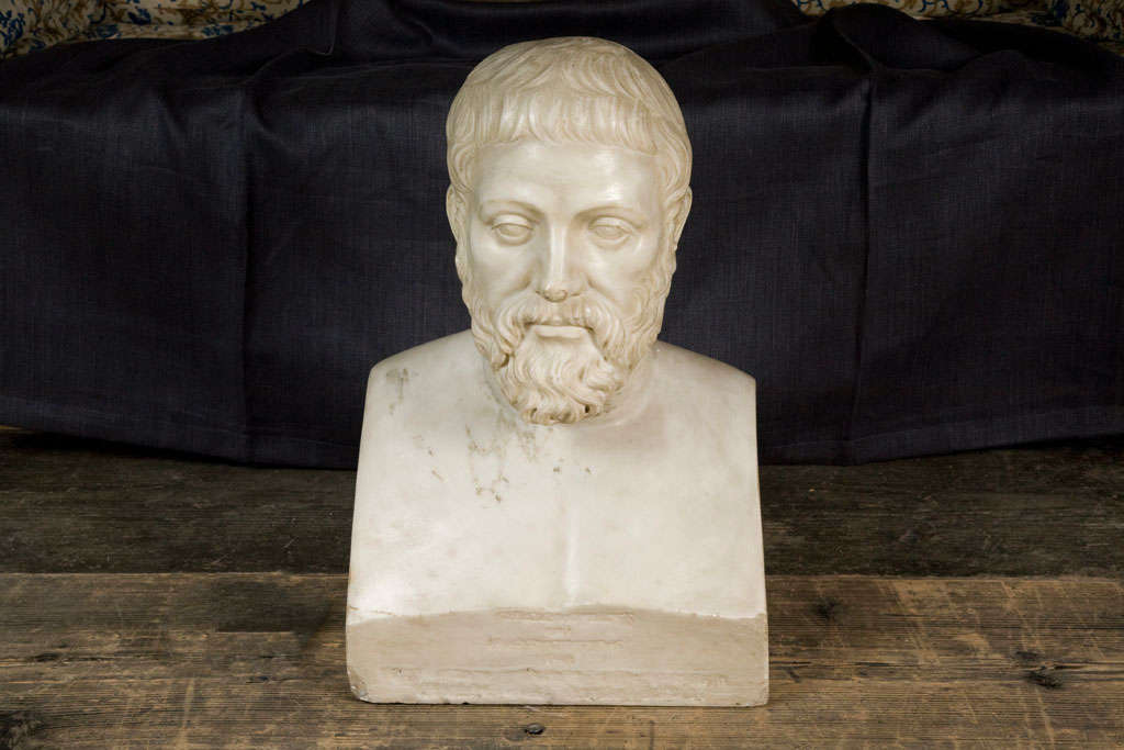 An early 19th century continental carved marble bust of a scholar. The bearded gentleman gazing forward, traces of old inscription to base.