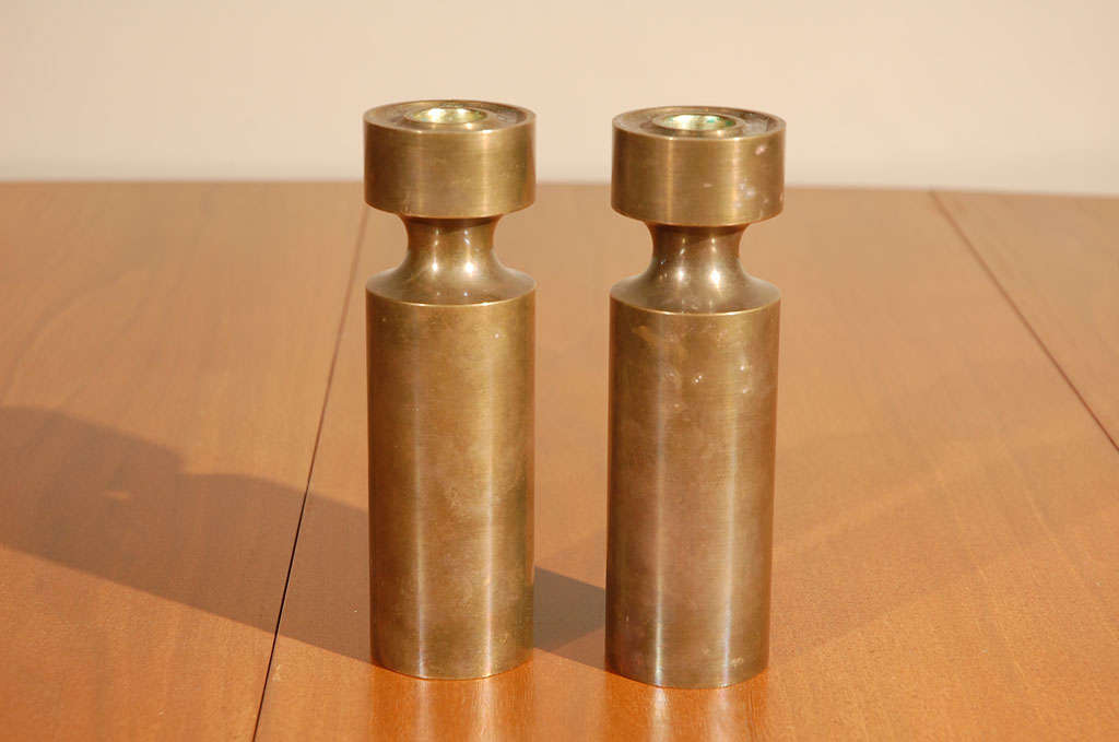 Bronze industrial candlesticks.