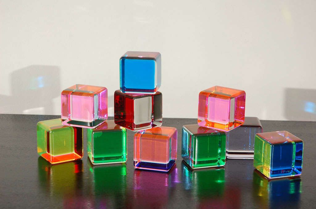 Set of 10 Vasa cube sculptures in an assortment of colors.  Each cube has several different colors inside it.   The price is for the entire set of ten.  One is signed.