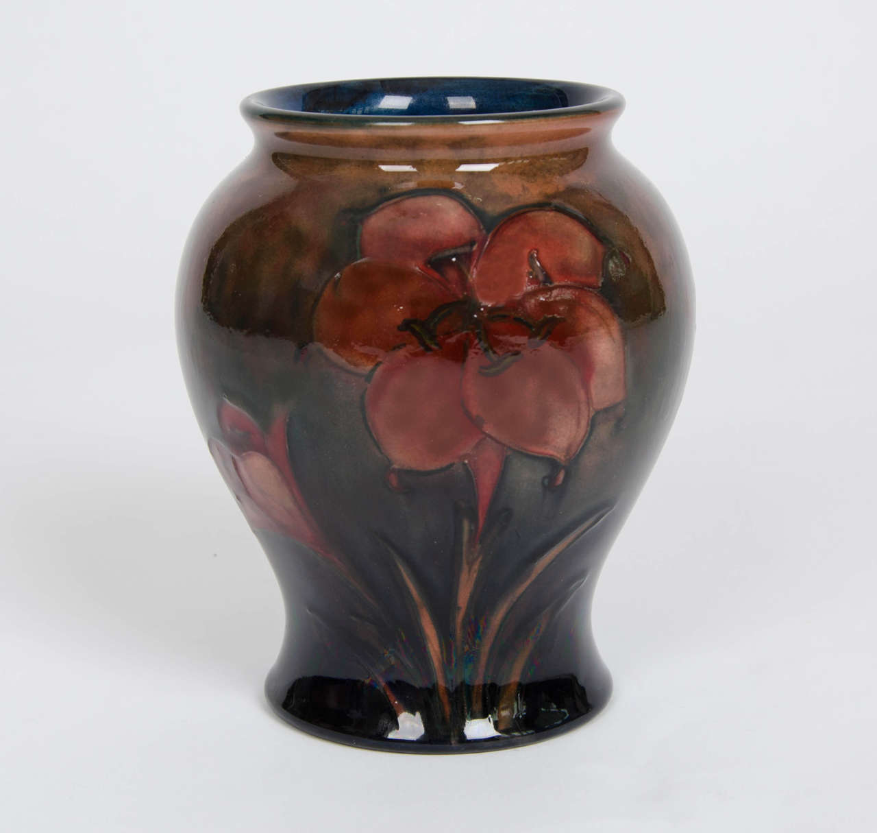 This is an excellent example of the superb Flambe Glaze wares, as first developed by William Moorcroft in 1919 and used by him till early 1945, his son Walter continuing with his own version of Flambe wares thereafter.

This pottery vase is in the