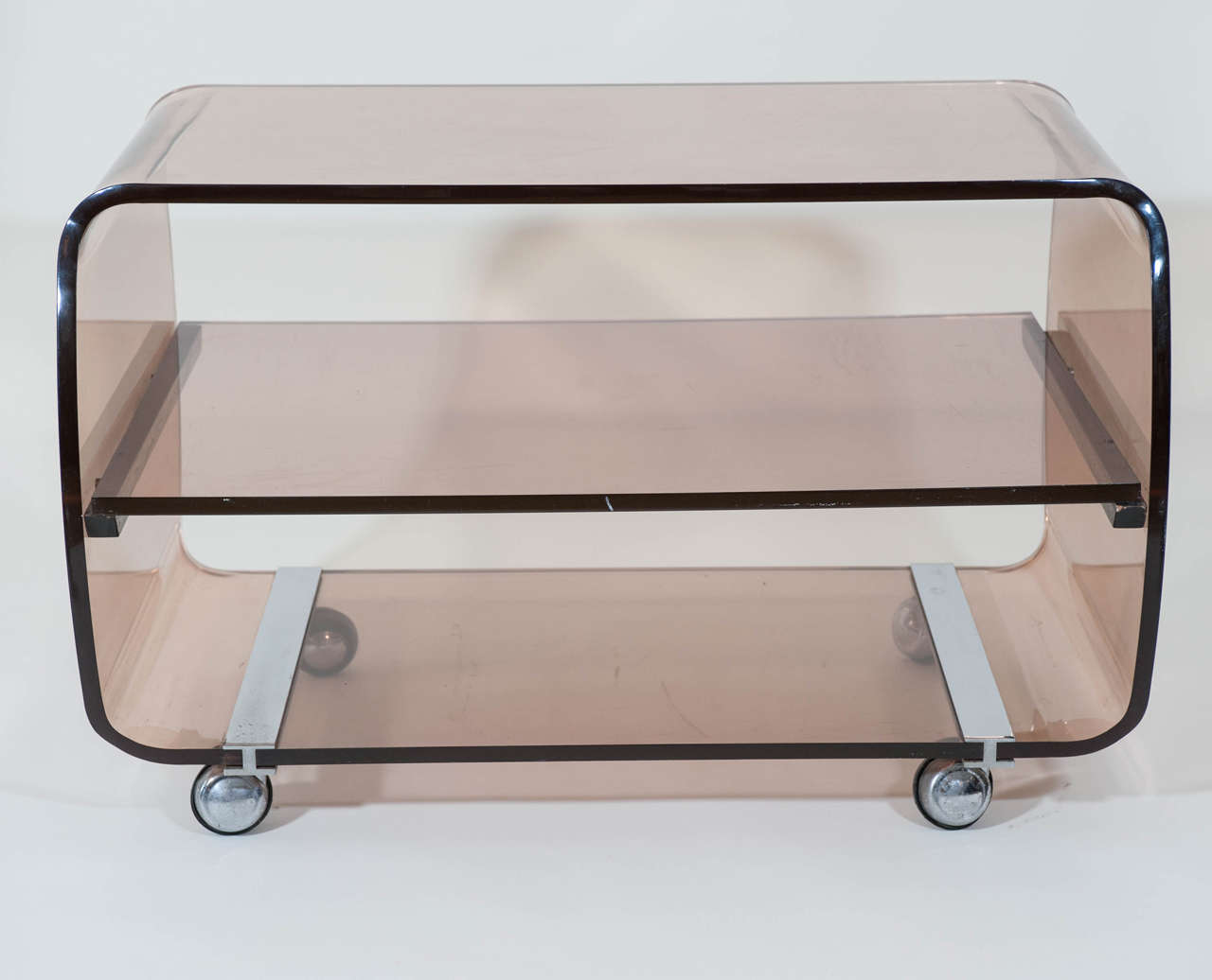 A chic trolley or TV stand in a rose colored hue with original hardware and castors.
