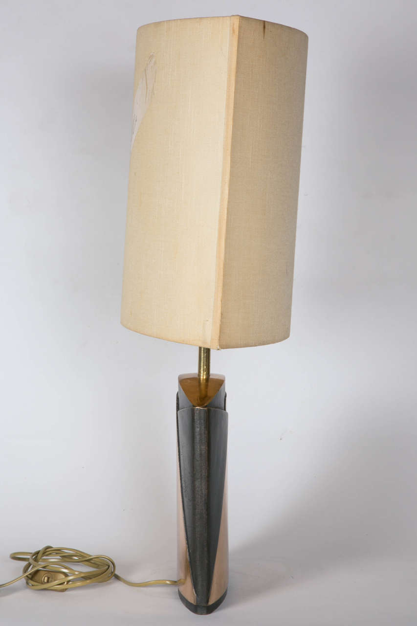 Pair of double patina table lamps signed by Esa Fedrigolli. Shades are not provided.. Dimensions are given without shade.