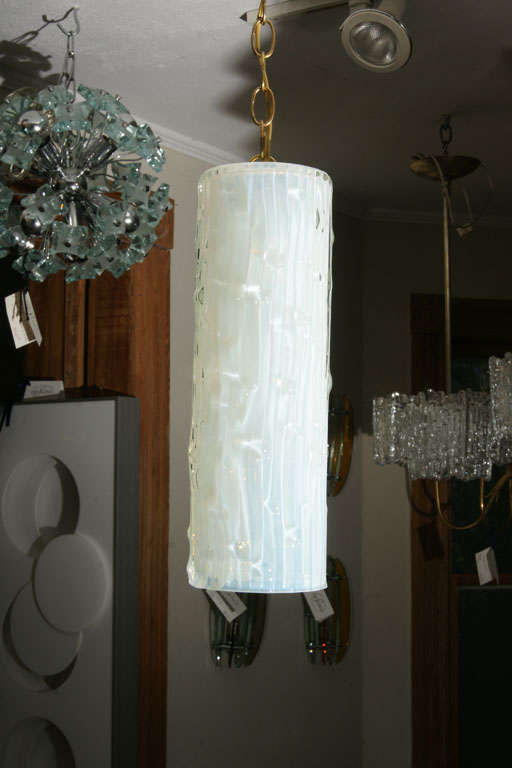 Cylindrical textured Sabino glass pendant ceiling fixture.