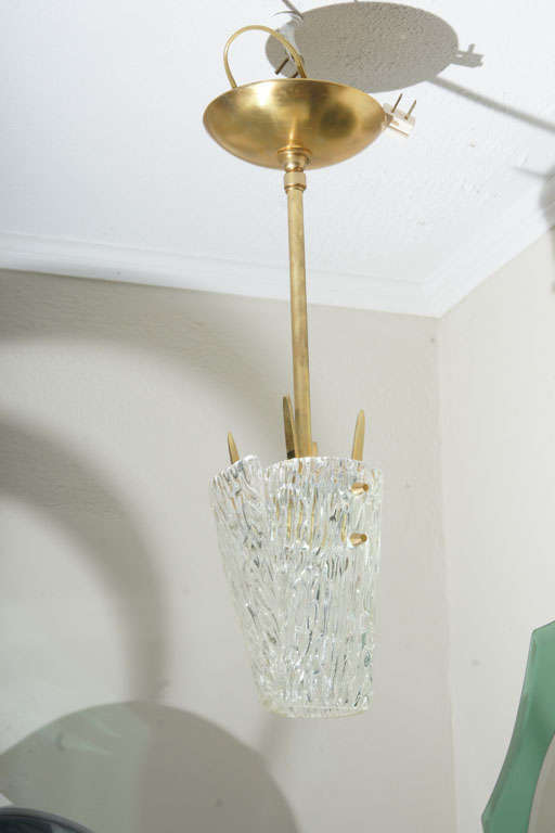 Textured glass petite pendant ceiling fixture with brass hardware and layered shade.