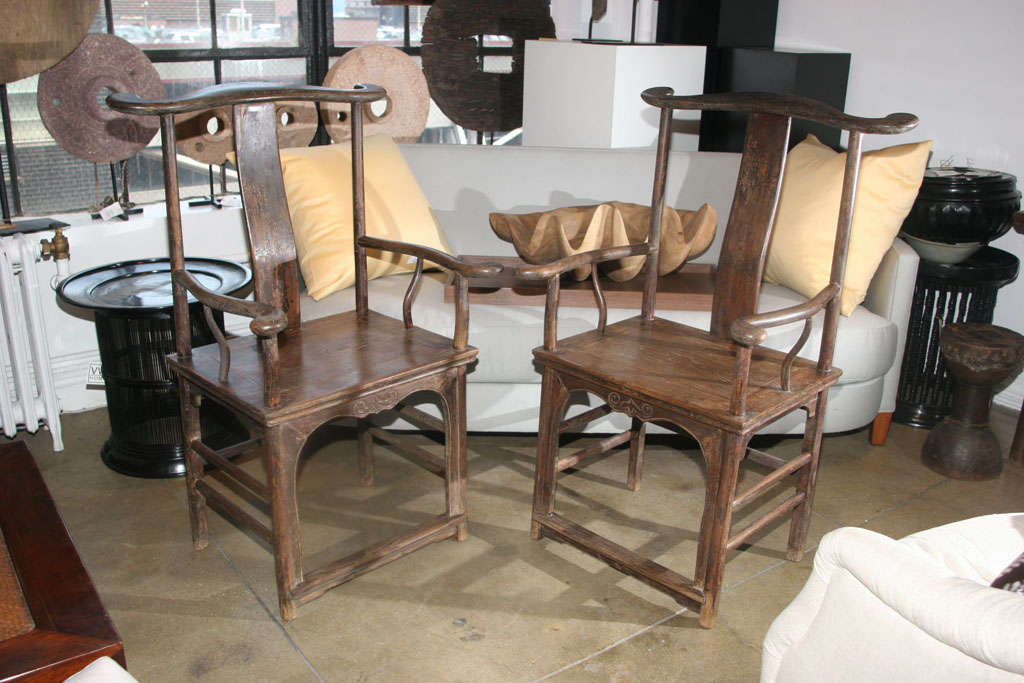 A pair of tall Minister Hat Arm Chairs, from Beijing, 18th Century.  Elmwood. Sold separately.
