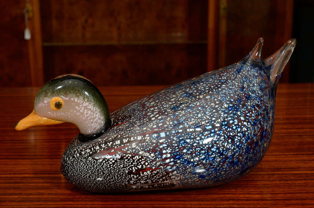 A beautiful example of a 1950s Italian Murano glass mallard decorated with beautiful silver flake body and highlights of red and blue  throughout.