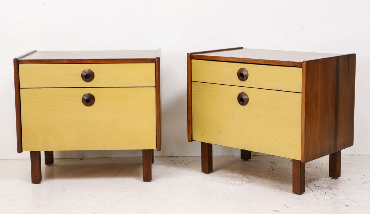 Pair of Solid Walnut Nightstands. Stained color doors. Original color.
Solid walnut construction. Dovetailed drawers. Solid carved pulls.