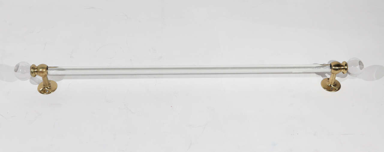 42 inch long glass towel bar with polished brass ends, bar is 1 inch in diameter. Two available.