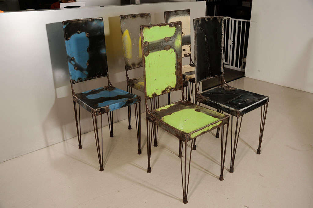 Recycled metal chairs individually colored and priced in blue, green,

vanilla and yellow.