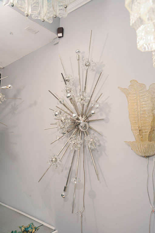 Custom monumental crystal starburst sconce in nickel finish. Customization is available in different sizes and finishes.