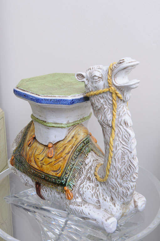 Whimsical and decorative glazed terra cotta camel garden seat. Beautifully detailed and colorful piece.