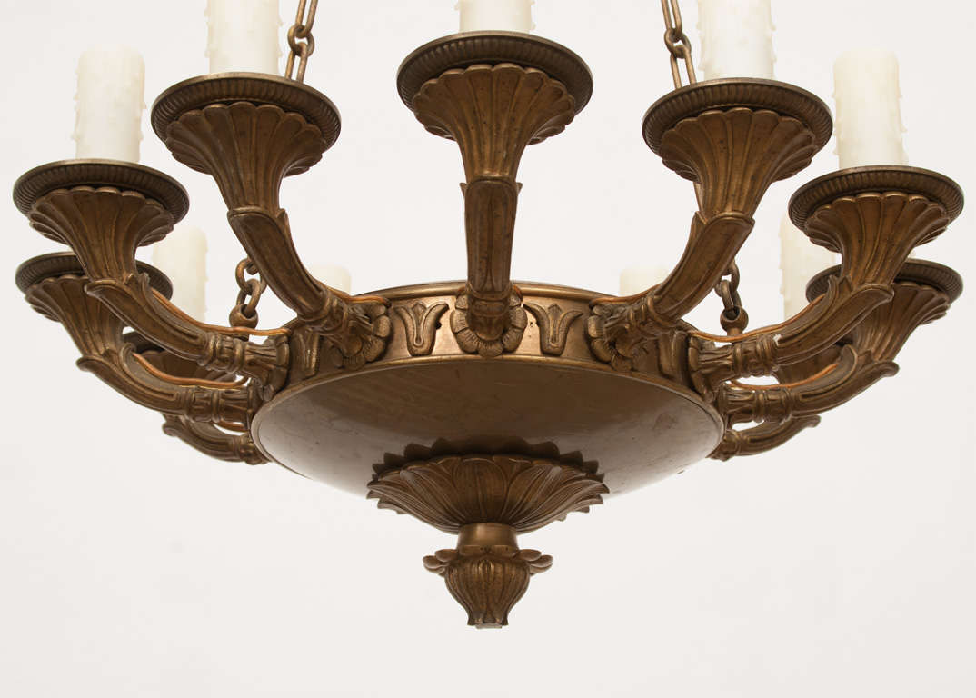This fixture was originally candle burning and appears to have been first electrified around 1900 - excellent casting - unique 12 light design gives the chandelier a sumptuous look.