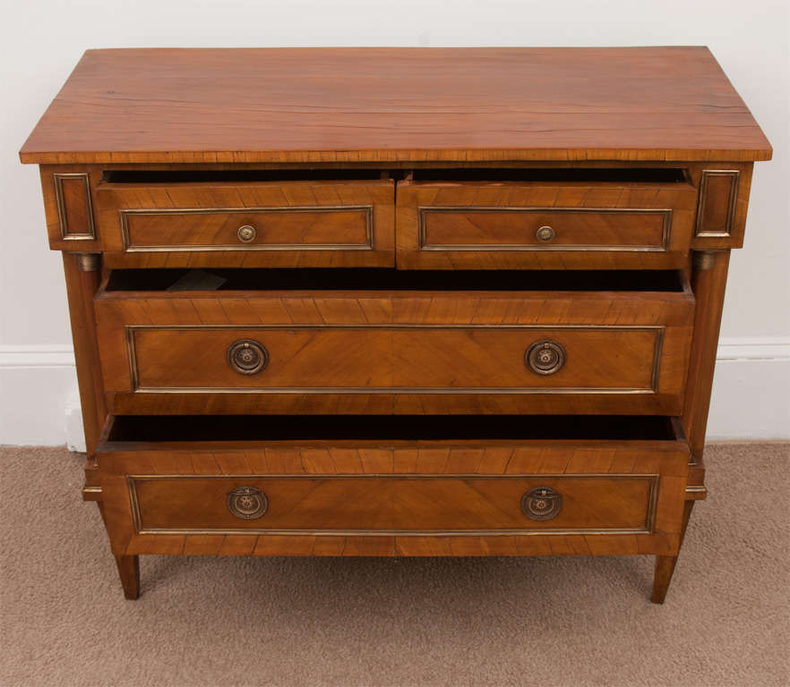 This chest is a wonderful size. The wood has a rich glow from the old French polish and the ormulu mounts and pulls have an excellent patina. Two small drawers over 2 large drawers -original slender Directoire legs.