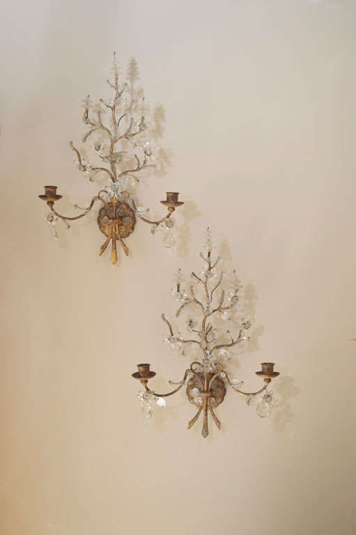 A Graceful Pair of Gilded Wrought-Iron and Glass Sconces