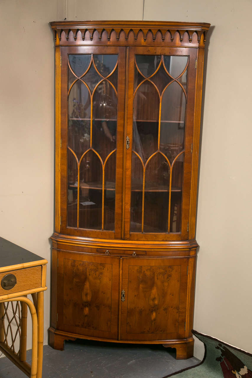An English bow front corner cabinet by Bevan Funnell. Stamped 