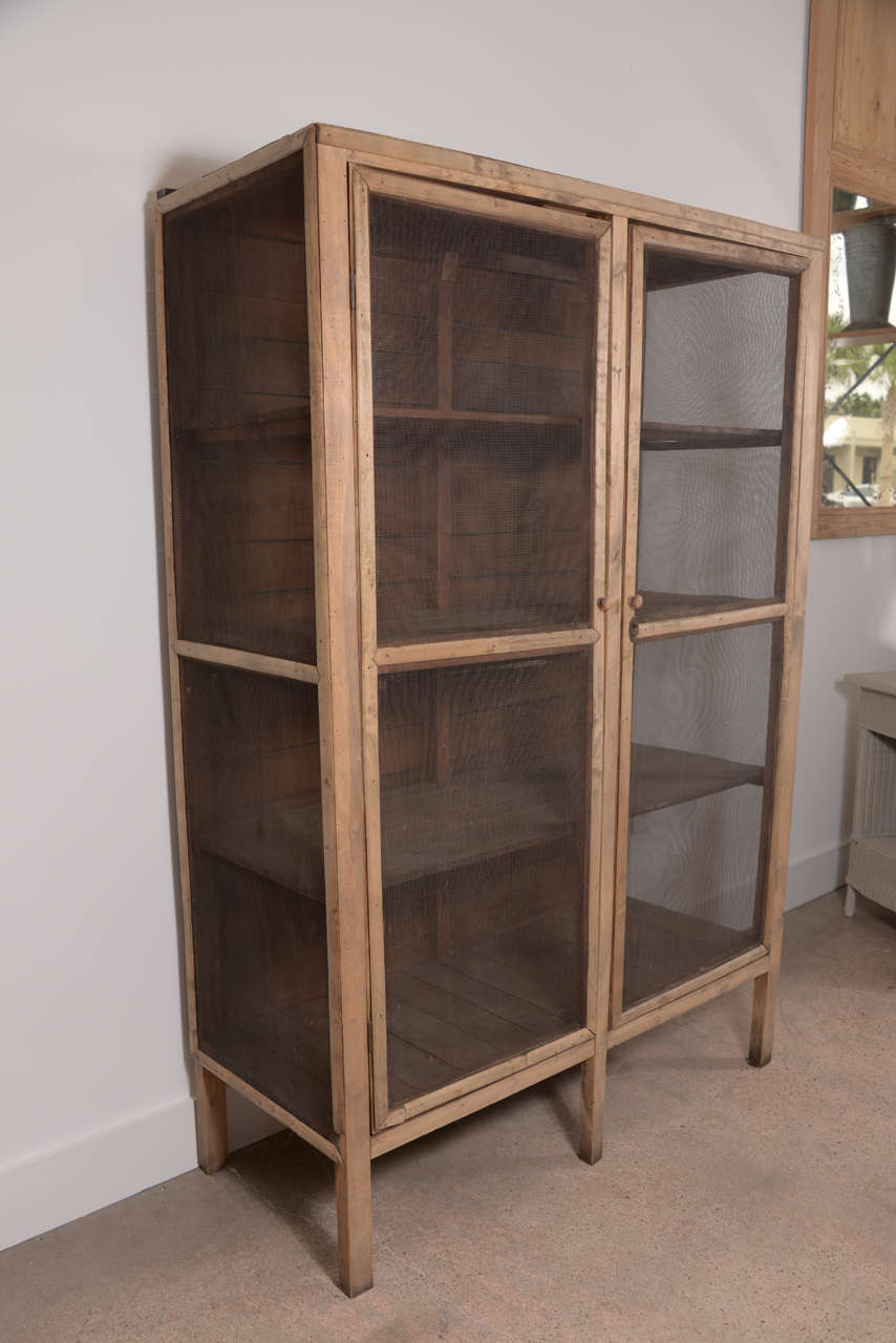 Early 19th century pine and wire mesh pastry cabinet.