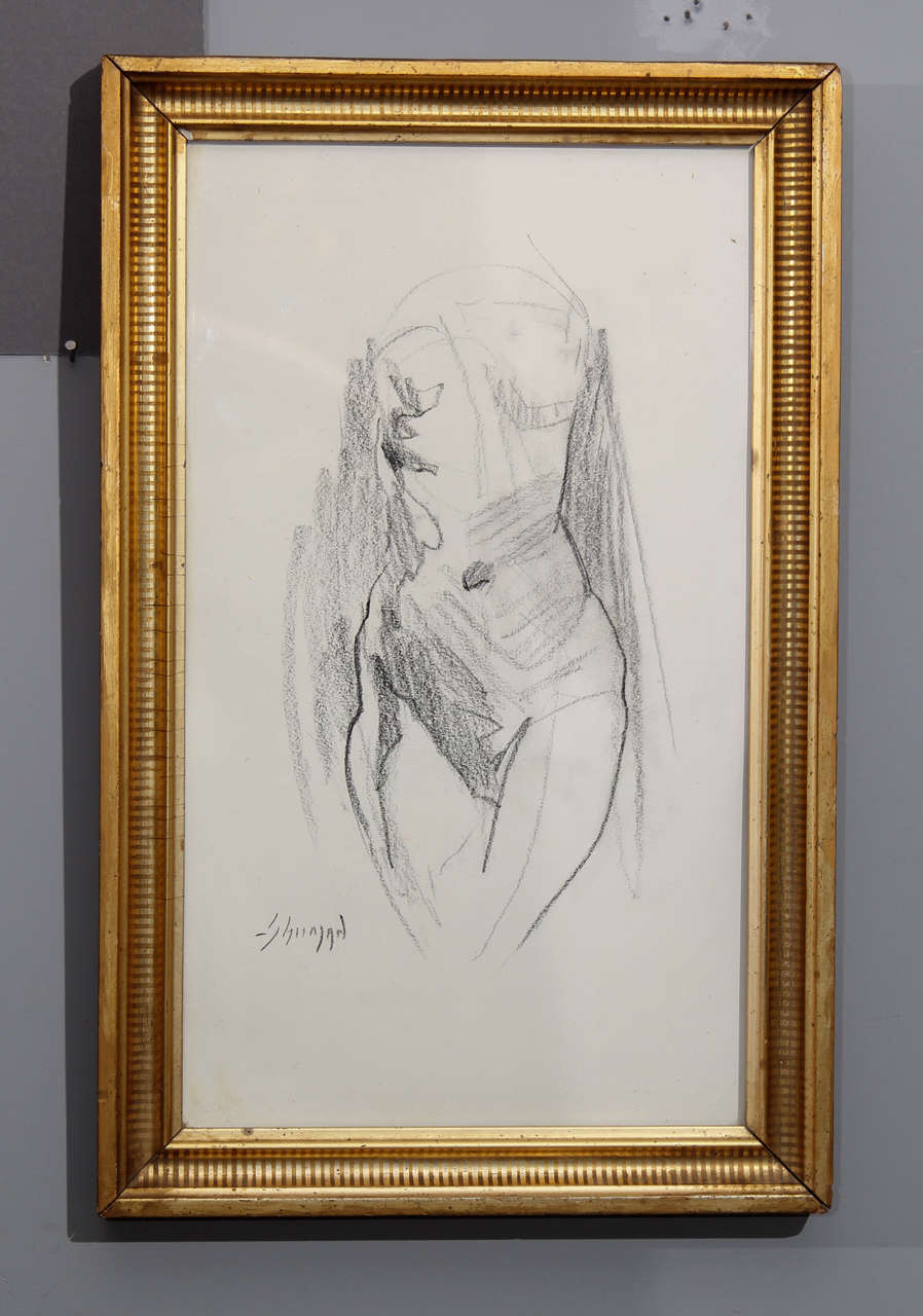 Charcoal sketch of female torso in gilt frame with raw wood outer frame.