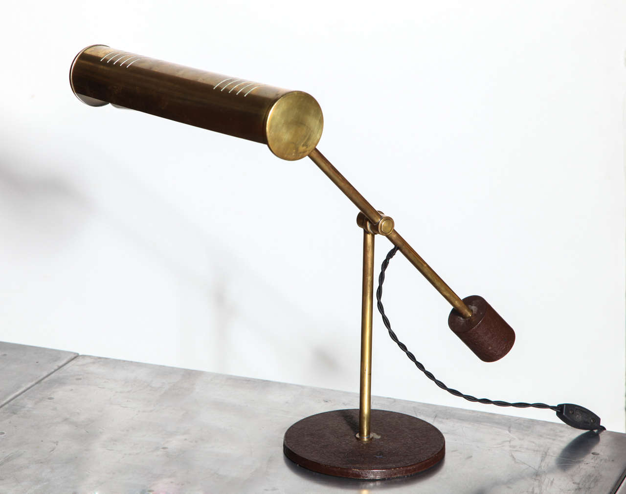 circa 1981 Mark Heinlein for Nessen Studios, solid Brass Task Lamp 
with original patina, adjustable perforated Brass cylindrical Shade 
and counterbalance handle on a 7