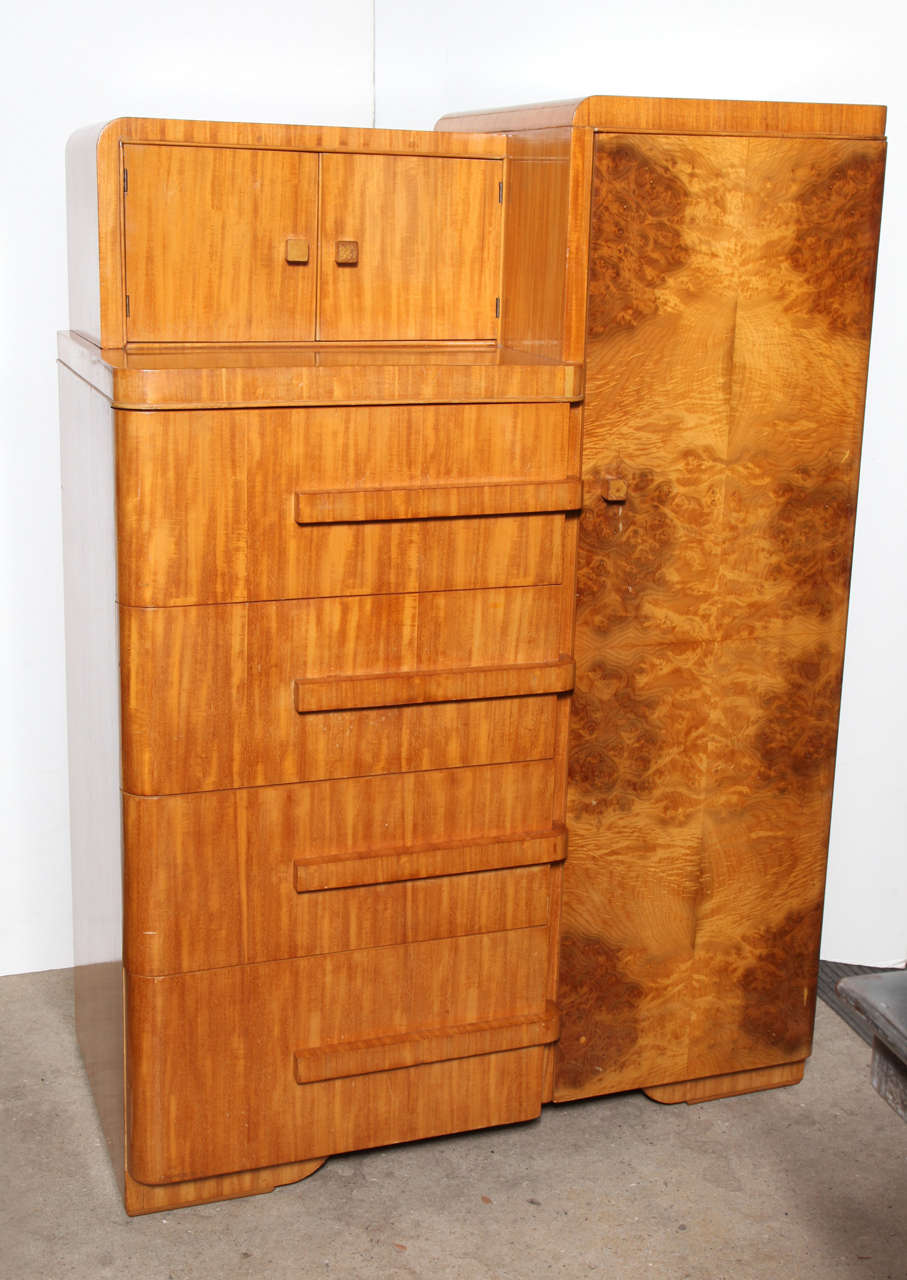 signed Williamsport Furniture Company bleached Mahogany Chifferobe with 4 deep drawers, smaller recessed 2 door cabinet atop and beautifully grained matched Burl Olive wood closet door.  Complete with interior bar for hanging clothes.  Great storage