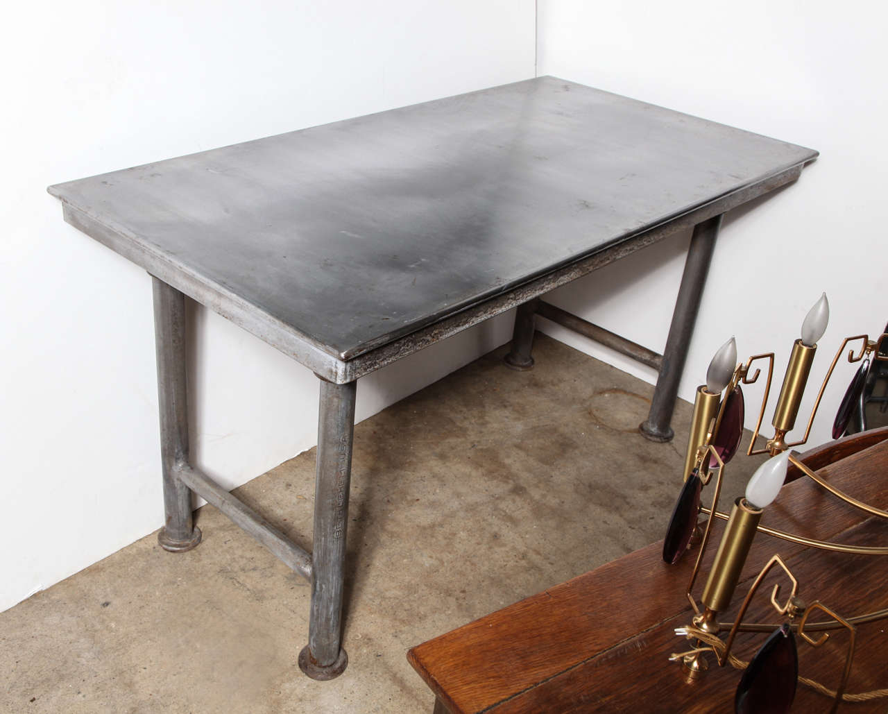 Heavy Steel textile work Table with heavy duty joints, round legs and 2 horizontal end supports.  Great multi - use piece.  Fantastic Table for Kitchen, Dining, Serving or Display.  Also good as Desk or HDTV stand.  With levelers; restored, paint