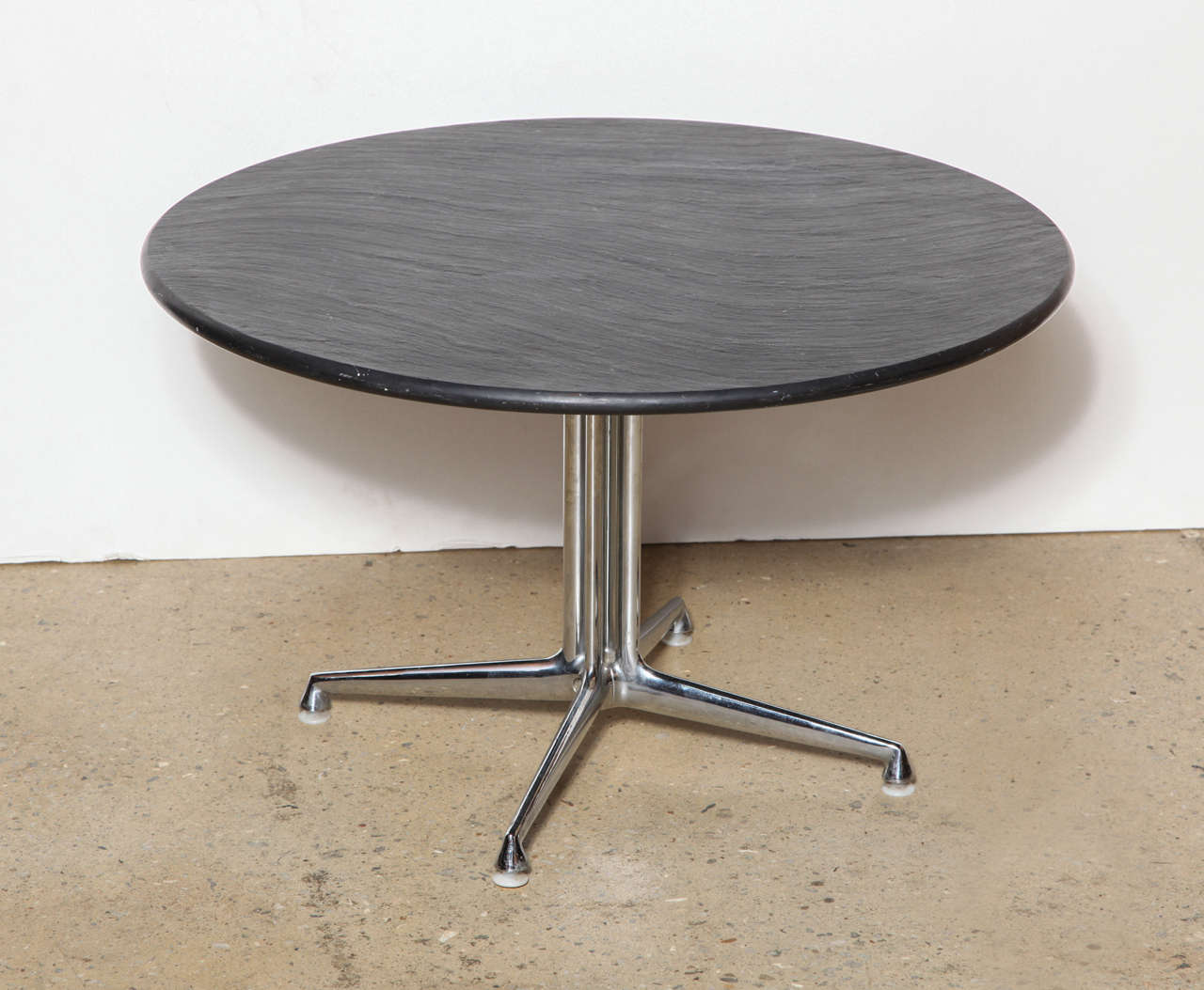 Modern American, 1960s Eames for Herman Miller La Fonda occasional table. Featuring the original, circular dark charcoal gray slate top, four-footed chrome pedestal base and white metal glides. Excellent for compact space, classic, with label.