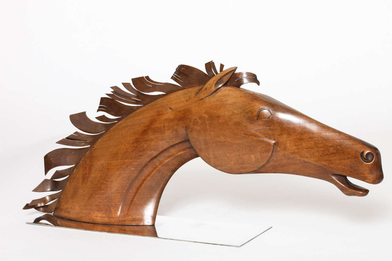 A Monumental Hagenauer Sculpture of A Stylized Horse Head,
circa 1930. The Hand  Carved Horses Head is accentuated with 
a Copper Mane on a Nickel Plated Metal Base. Mint Condition.
Marked WHW (Werkstatte, Hagenauer, Wein), and Made in Austria.